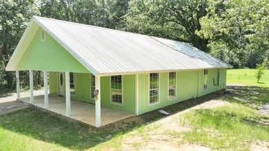 Discover the perfect starter home or weekend getaway in this - photo 2