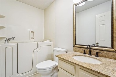 Priced to sell & nestled within the gates of Beau Chene, this - photo 11