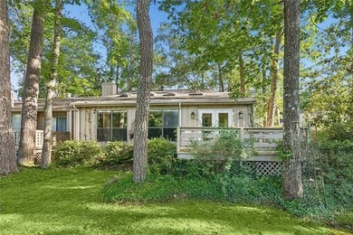 Priced to sell & nestled within the gates of Beau Chene, this - photo 17