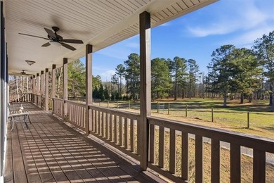 Behind a gated entrance, a private drive opens to five acres of - photo 2