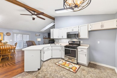 This brick ranch home sits in a peaceful wooded area at the end