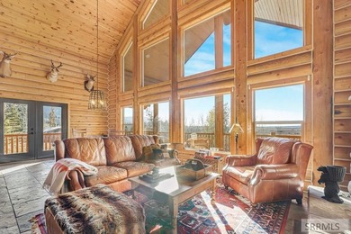 Perched on a half-acre of pristine land, this full-log retreat - photo 4