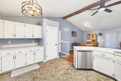 This brick ranch home sits in a peaceful wooded area at the end