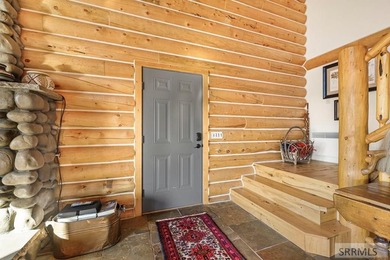 Perched on a half-acre of pristine land, this full-log retreat - photo 6