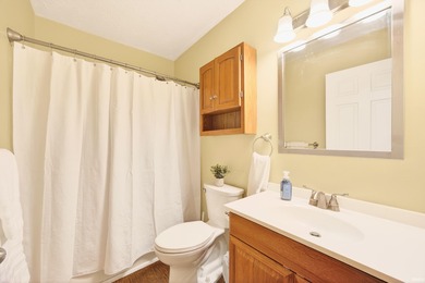 This brick ranch home sits in a peaceful wooded area at the end