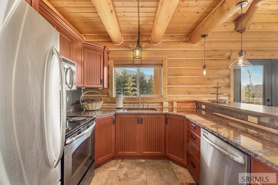 Perched on a half-acre of pristine land, this full-log retreat - photo 9