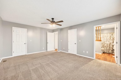 This brick ranch home sits in a peaceful wooded area at the end