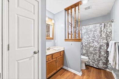 This brick ranch home sits in a peaceful wooded area at the end