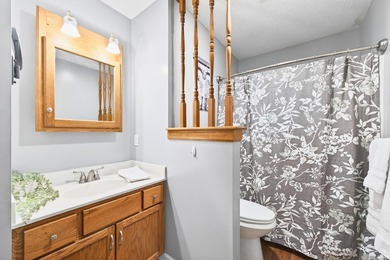 This brick ranch home sits in a peaceful wooded area at the end