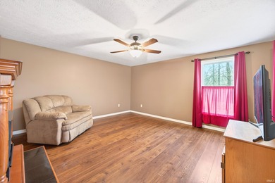 This brick ranch home sits in a peaceful wooded area at the end