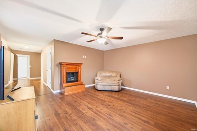 This brick ranch home sits in a peaceful wooded area at the end