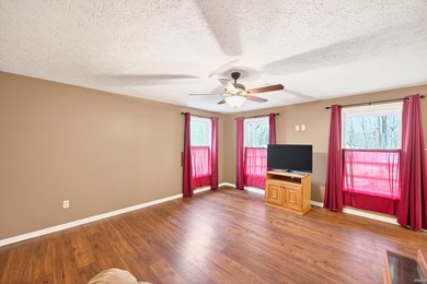 This brick ranch home sits in a peaceful wooded area at the end