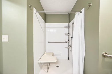 This brick ranch home sits in a peaceful wooded area at the end