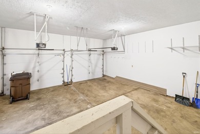 This brick ranch home sits in a peaceful wooded area at the end