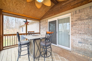 This brick ranch home sits in a peaceful wooded area at the end