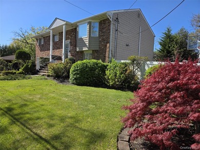 Spacious hi ranch with 4 bedrooms and 3 full bathrooms, set on - photo 2