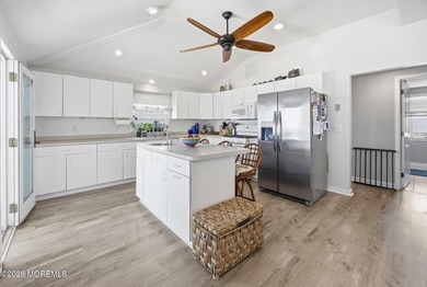 Experience elevated bayfront living in this exceptional - photo 11
