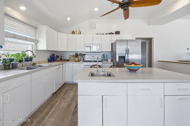 Experience elevated bayfront living in this exceptional - photo 13