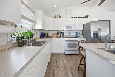 Experience elevated bayfront living in this exceptional - photo 14