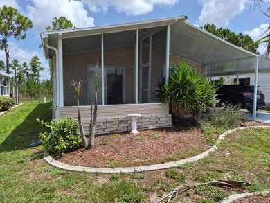 Free Golf Anyone?? This nice double wide home offers 2 bedrooms - photo 1