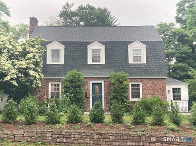 Welcome home to this picturesque brick Colonial, where timeless - photo 1