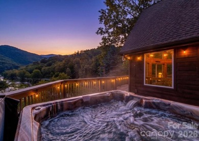 Escape to this warm and inviting 1.5-story mountain home set on - photo 1