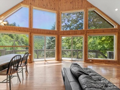 Escape to this warm and inviting 1.5-story mountain home set on - photo 3
