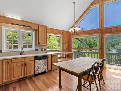 Escape to this warm and inviting 1.5-story mountain home set on - photo 5