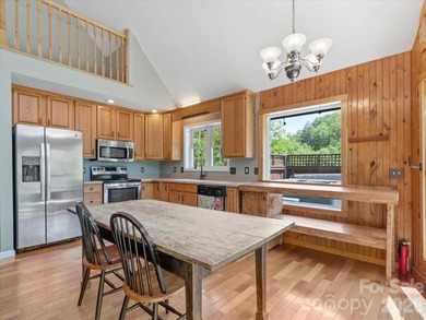Escape to this warm and inviting 1.5-story mountain home set on - photo 6