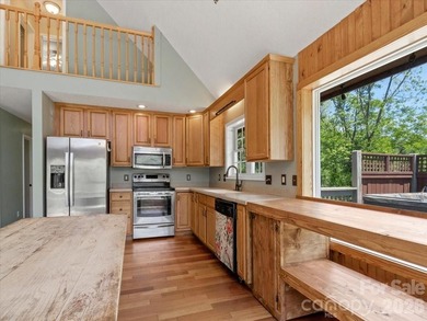 Escape to this warm and inviting 1.5-story mountain home set on - photo 8