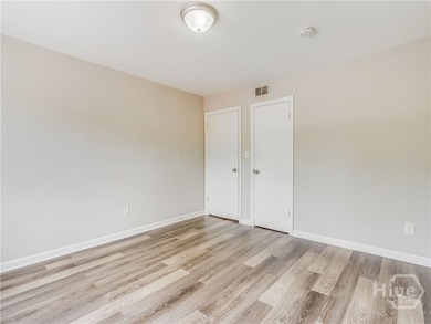 Solid and low-maintenance, this all-brick triplex sits in Garden - photo 11