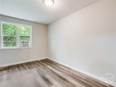 Solid and low-maintenance, this all-brick triplex sits in Garden - photo 13