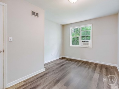 Solid and low-maintenance, this all-brick triplex sits in Garden - photo 14