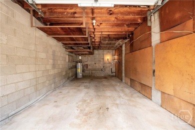 Solid and low-maintenance, this all-brick triplex sits in Garden - photo 18