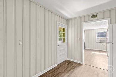 Solid and low-maintenance, this all-brick triplex sits in Garden - photo 22