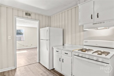 Solid and low-maintenance, this all-brick triplex sits in Garden - photo 23