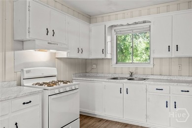 Solid and low-maintenance, this all-brick triplex sits in Garden - photo 24