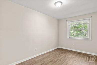 Solid and low-maintenance, this all-brick triplex sits in Garden - photo 26