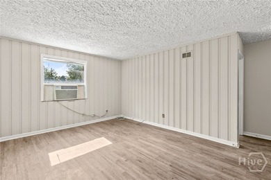 Solid and low-maintenance, this all-brick triplex sits in Garden - photo 31