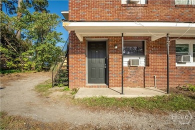 Solid and low-maintenance, this all-brick triplex sits in Garden - photo 32