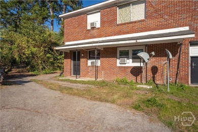 Solid and low-maintenance, this all-brick triplex sits in Garden - photo 33