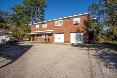 Solid and low-maintenance, this all-brick triplex sits in Garden - photo 34