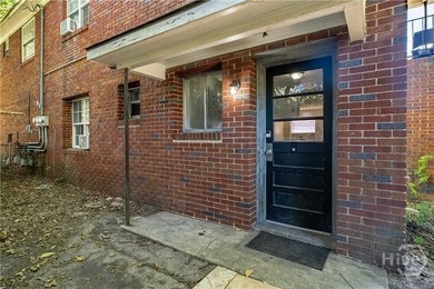 Solid and low-maintenance, this all-brick triplex sits in Garden - photo 35