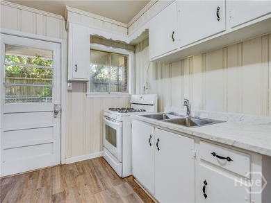 Solid and low-maintenance, this all-brick triplex sits in Garden - photo 40