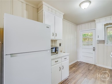 Solid and low-maintenance, this all-brick triplex sits in Garden - photo 42