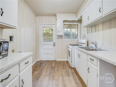 Solid and low-maintenance, this all-brick triplex sits in Garden - photo 43