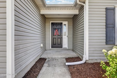 Welcome to this charming 3-bedroom, 2-bath home in the highly - photo 4