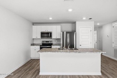 PRICE REDUCTION! Experience peaceful pondfront living in this - photo 15