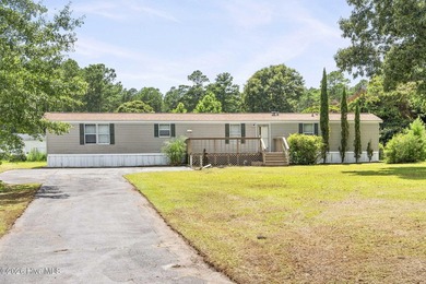 This 3 bedroom, 2 bathroom partially furnished home is an - photo 1