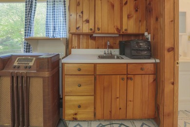 Nestled in the woods on beautifully landscaped grounds, this - photo 31